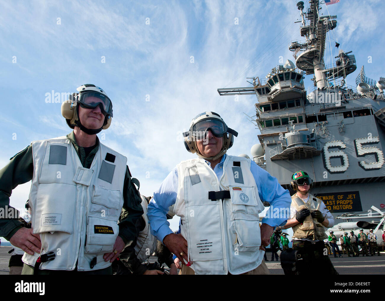 United States Secretary of Defense Leon E. Panetta, right, and Rear Admiral Walter E. Carter, commander of Carrier Strike Group (CSG) 12, watch flight operations Saturday, January 21, 2012 aboard the aircraft carrier USS Enterprise (CVN 65). The Enterprise Carrier Strike Group is underway conducting a composite training unit exercise (COMPTUEX) in the Atlantic Ocean. .Mandatory Cre Stock Photo