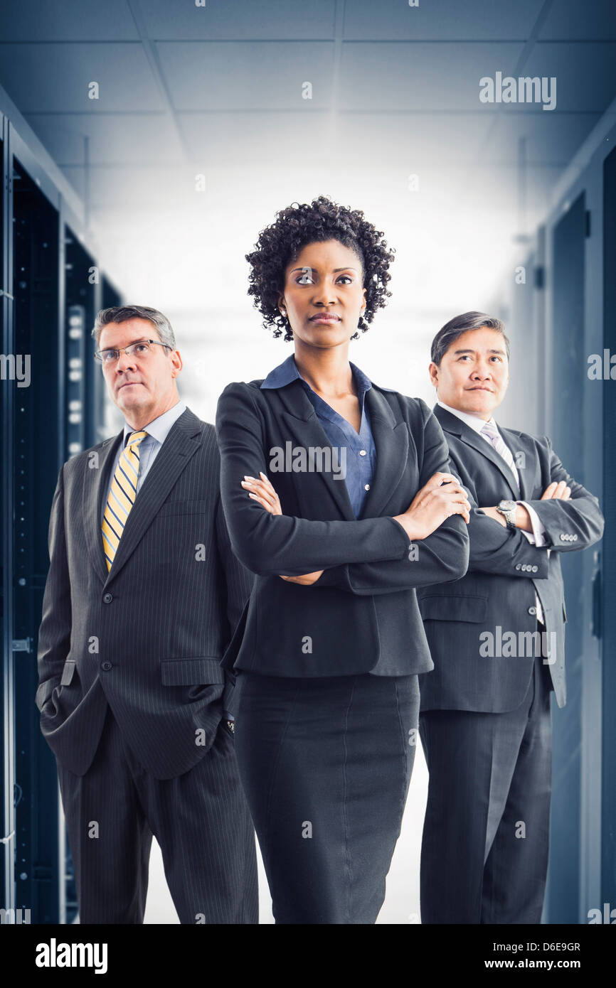 Businesspeople standing in office Stock Photo - Alamy