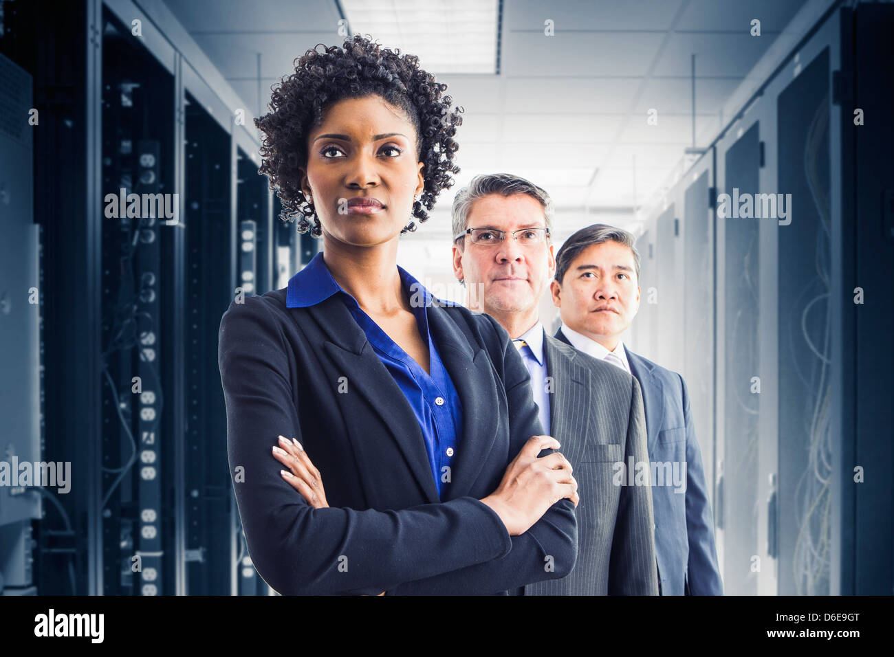 Businesspeople standing in office Stock Photo - Alamy