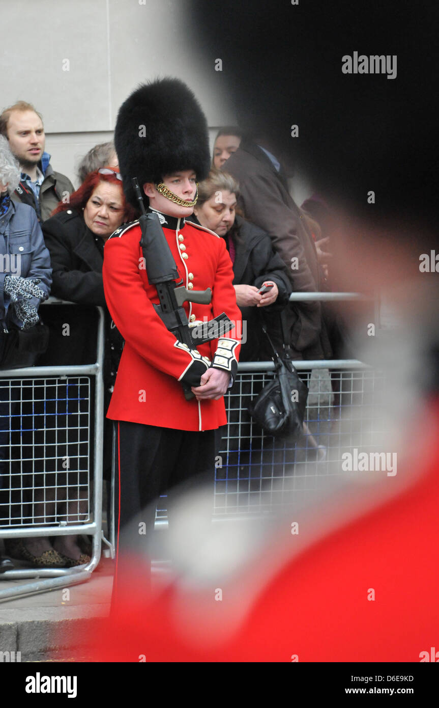 Ludgate Hill, London, UK. 17th April 2013. Uniforms of all regiments on guard for the procession towards St Paul's. The funeral procession of Baroness thatcher takes place along the streets of central London. Credit: Matthew Chattle/Alamy Live News Stock Photo