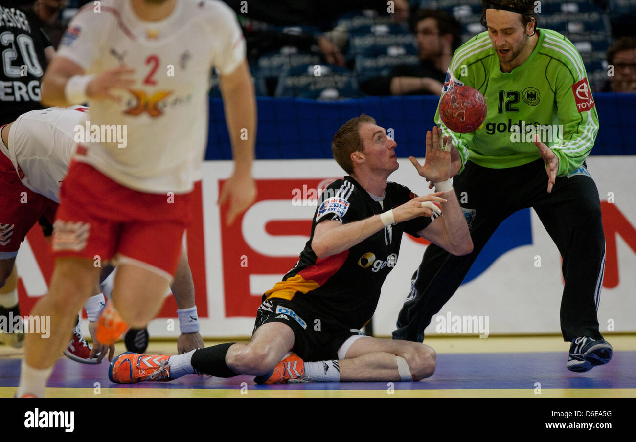 Germany's goalkeeper Silvio Heinevetter (R-L) and Holger Glandorf initiate a counter-attack during the Handball European Championship Group 1 match between Germany and Denmark in Belgrade, Serbia, 23 January 2012. Germany lost the match 26-28. Photo: JENS WOLF Stock Photo