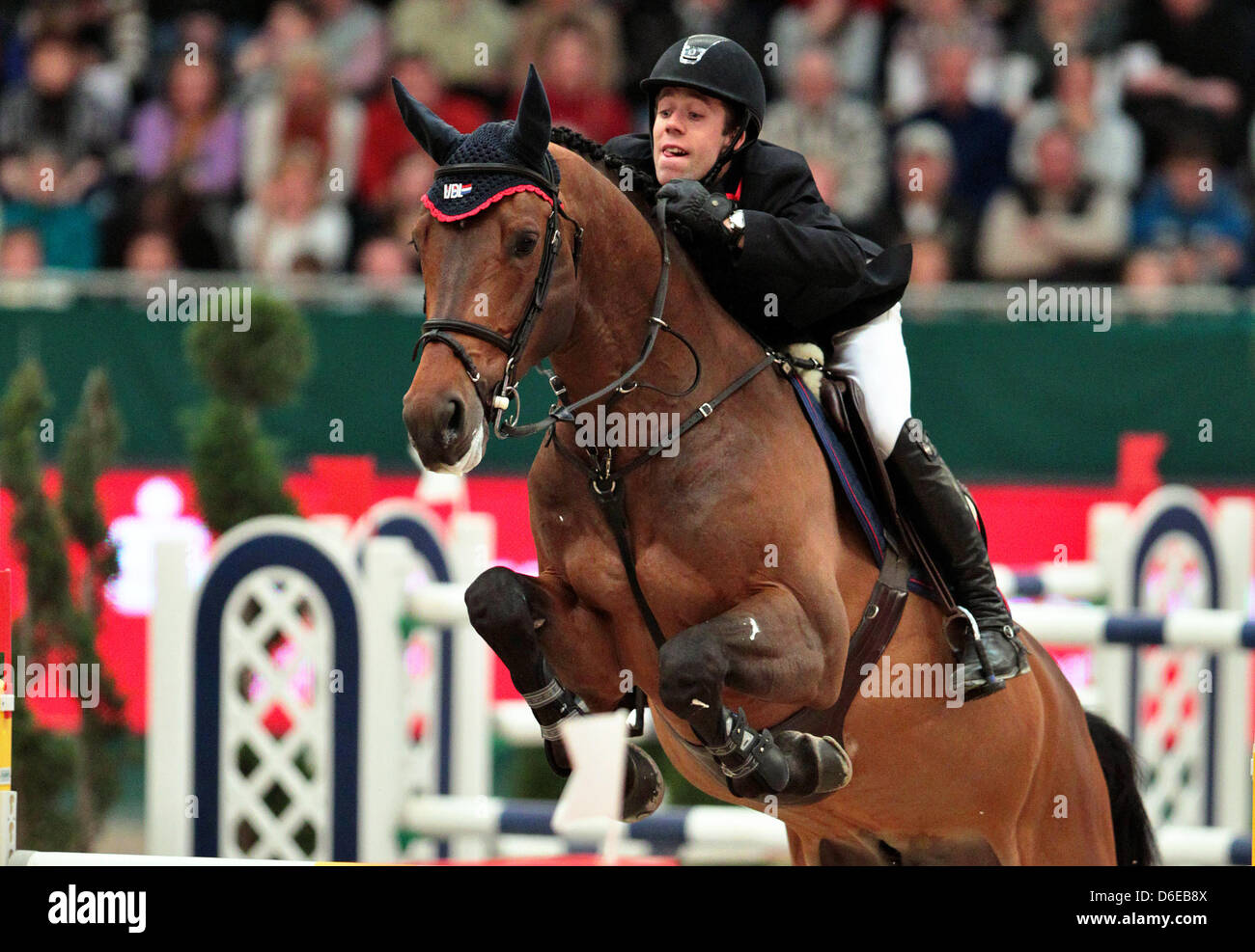 Dutch rider Maikel van der Vleuten jumps over a hurdle on VDL Groep ...