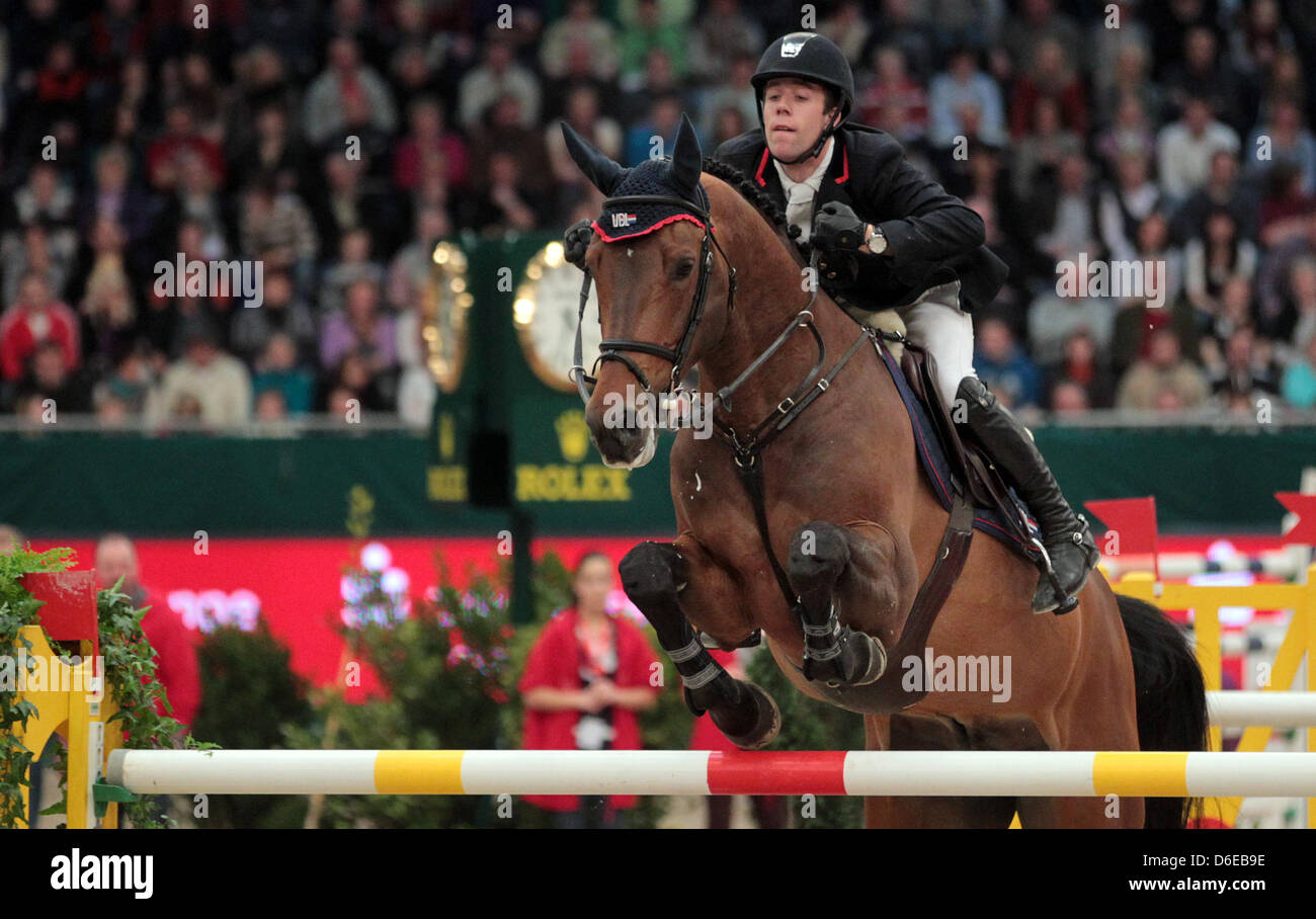 Dutch rider Maikel van der Vleuten jumps over a hurdle on VDL Groep ...