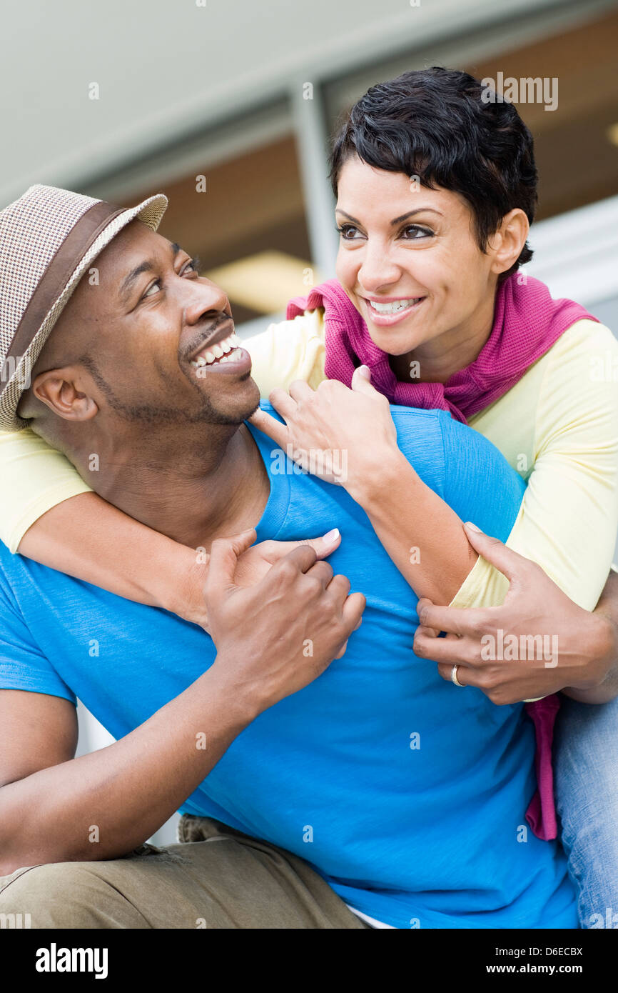 Smiling couple hugging outdoors Stock Photo - Alamy