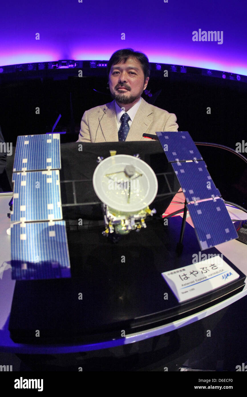 The Japanese film and computer graphics producer Hiromitsu Kohsaka attends the premiere of the film  'Hayabusa - Zurueck zur Erde' (Hayabusa - Return to Earth) while standing on front of a model of the space probe at the planetarium in Hamburg, Germany, 24 January 2012. The show, which had its European premiere in Hamburg, tells of the research space mission of the Japanese space p Stock Photo