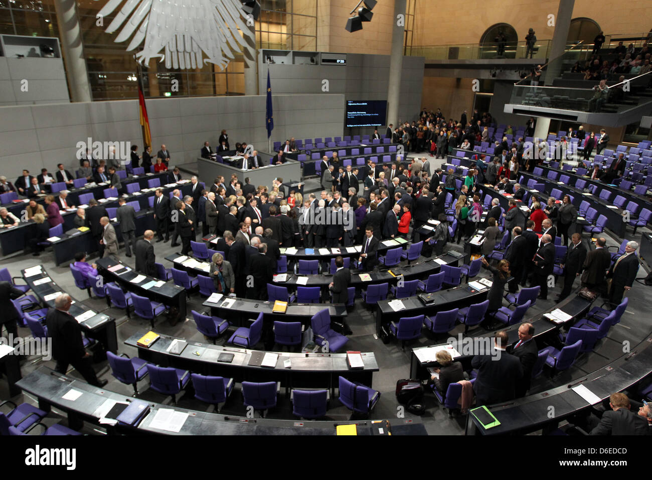 Members of the German Parliament cast their vote after a debate on the