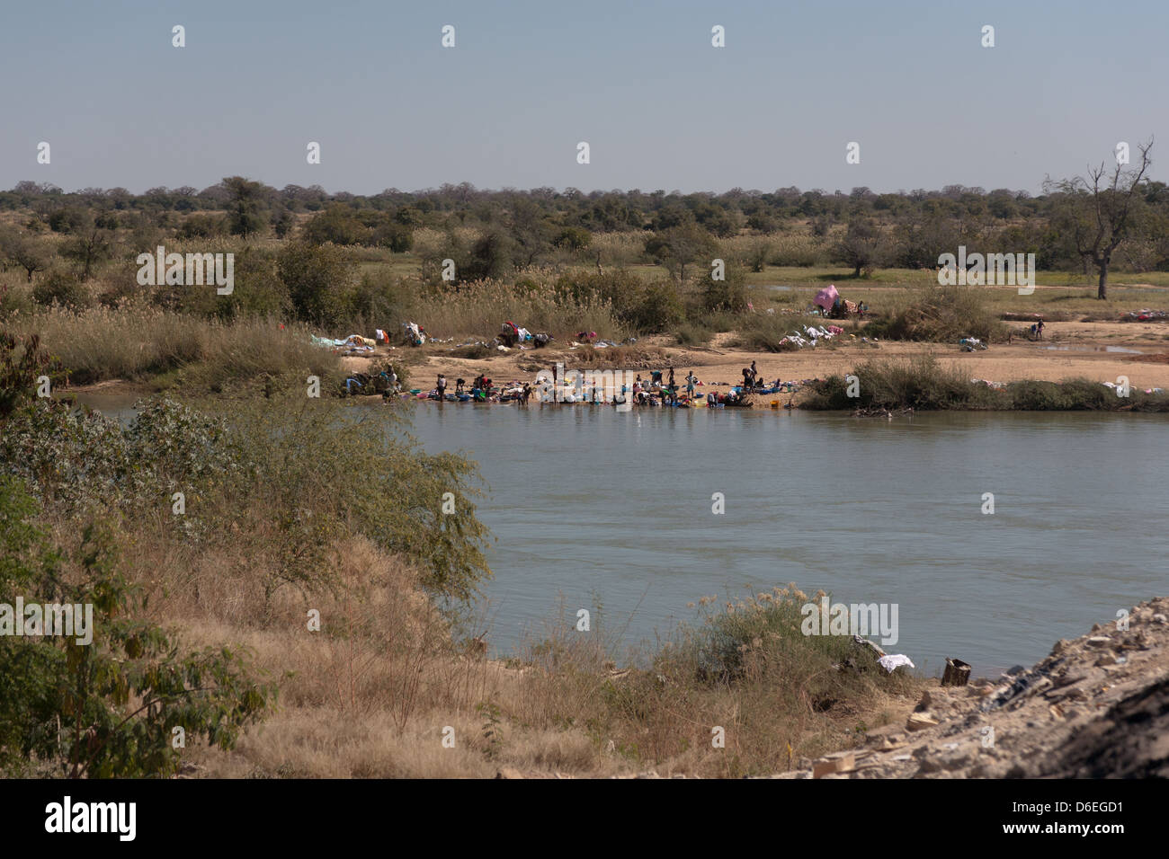 African community at the edge of the river doing washing up Stock Photo