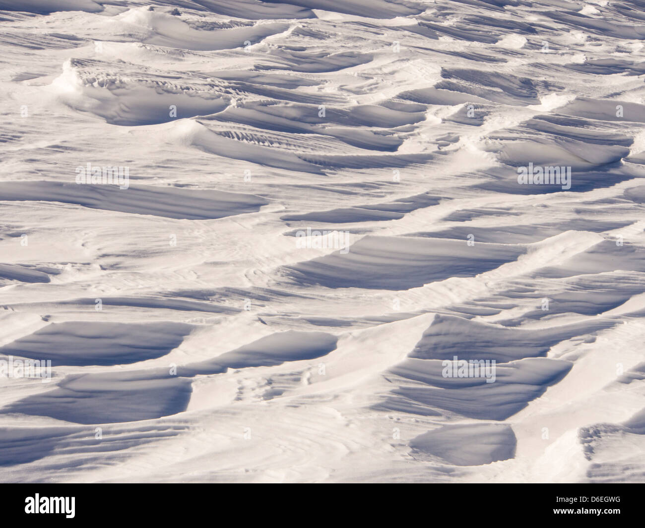 Sastrugi caused by wind scour on snow, Lake District, UK. Stock Photo