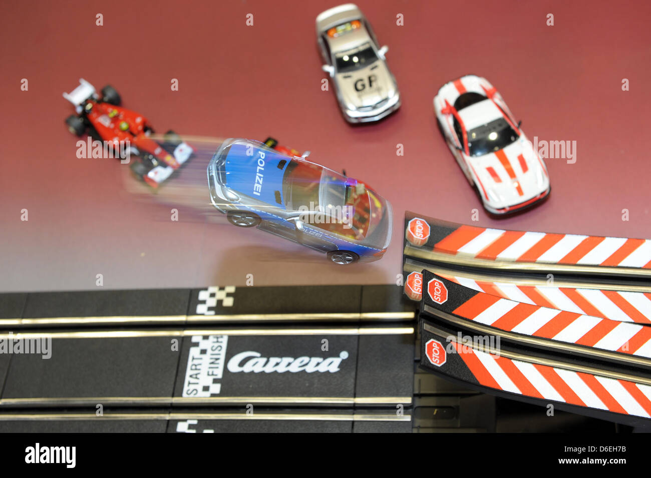 A police car jumps a ramp on a Carrera track at the 63rd International Toy  Fair in Nuremberg, Germany, 01 February 2012. At the world's largest toy  trade fair, 2,800 exhibitors from