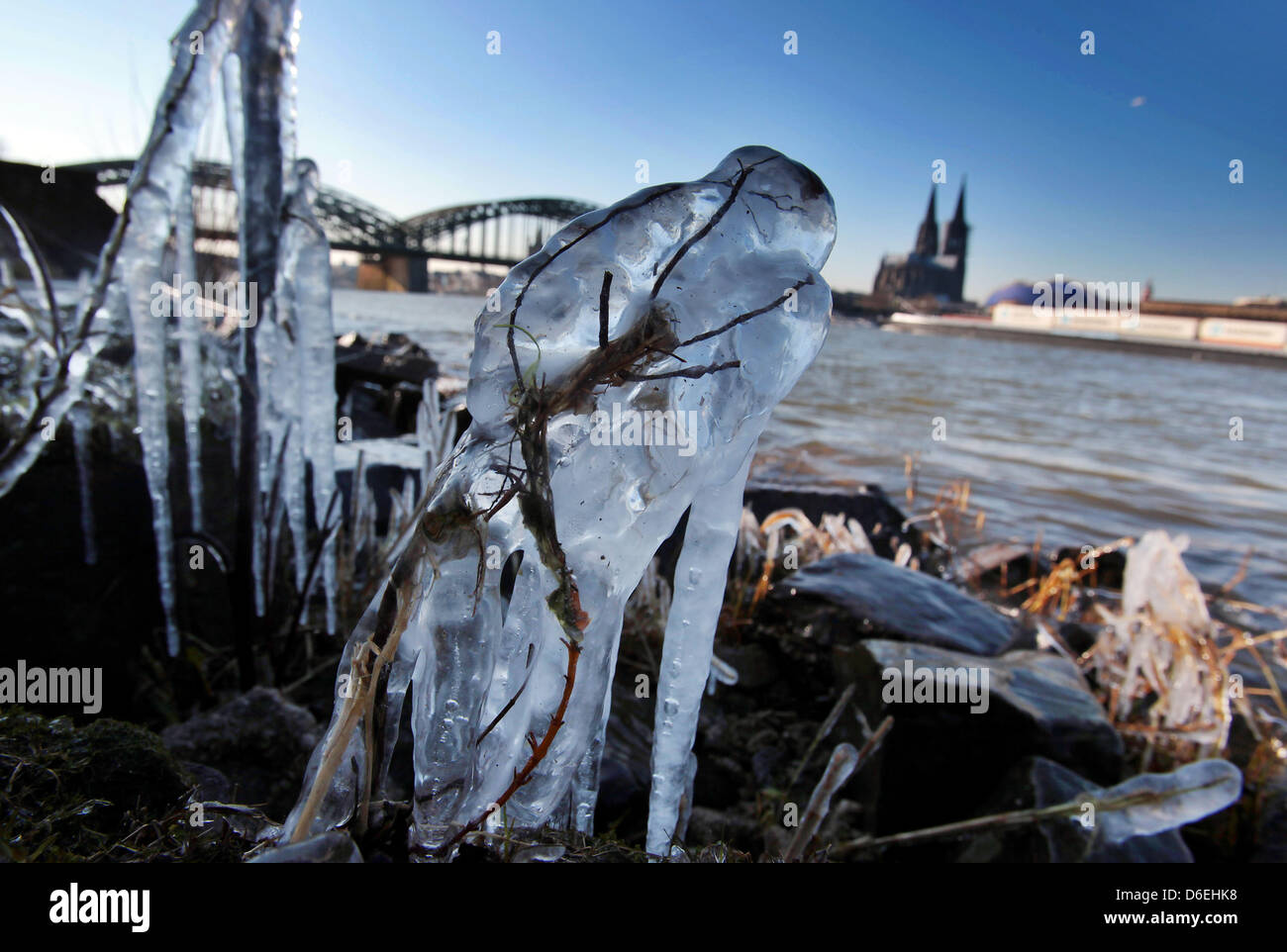 Icicles are visible at a shipping pier opposite to the Cologne