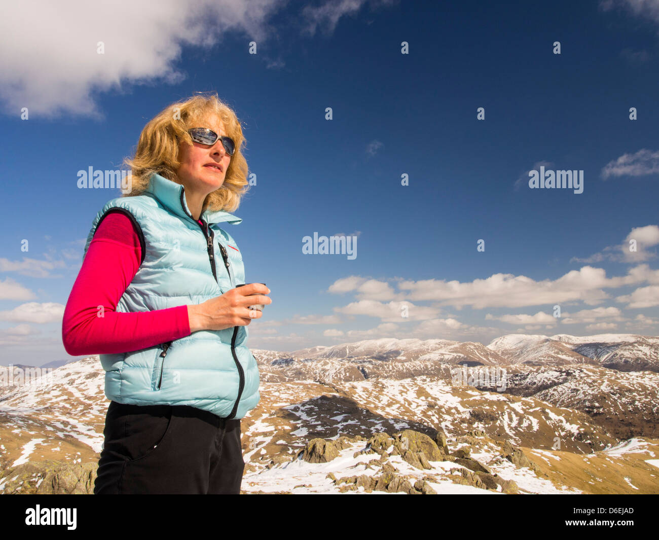 A woman fell walker on wet side Edge in the Lake District, Cumbria, UK