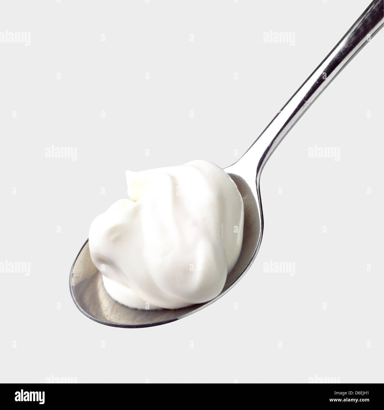 Spoon with yoghurt Stock Photo Alamy