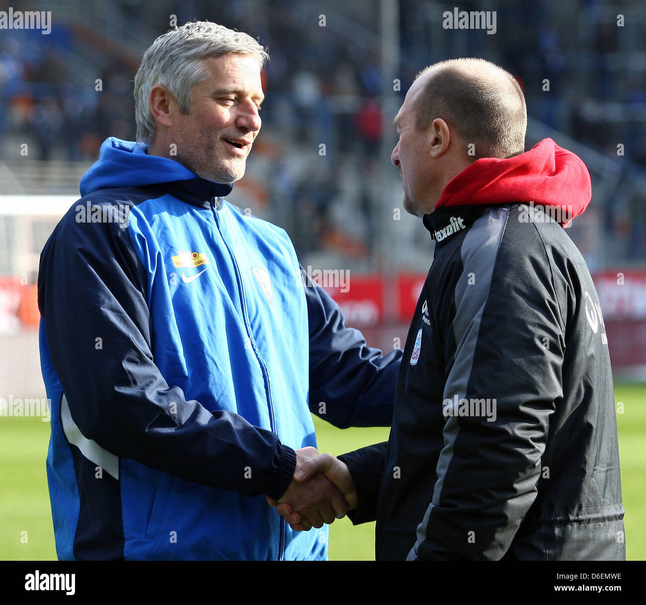 Bochum's head coach Andreas Bergmann (L) and Rostock's head coach Wolfgang Wolf shake hands prior to the German Bundesliga second devision match between VfL Bochum and Hansa Rostock at rewirpowerStadion in Bochum, Germany, 05 February 2012. Photo: Kevin Kurek Stock Photo