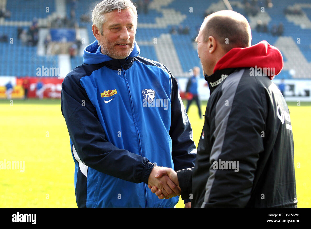 Bochum's head coach Andreas Bergmann (L) and Rostock's head coach Wolfgang Wolf shake hands prior to the German Bundesliga second devision match between VfL Bochum and Hansa Rostock at rewirpowerStadion in Bochum, Germany, 05 February 2012. Photo: Kevin Kurek Stock Photo