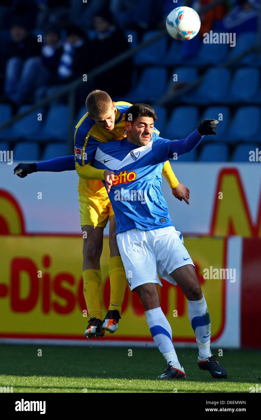Rostock's Stephan Gusche (L) vies for the ball with Bochum's Mirkan Aydin during the German Bundesliga second devision match between VfL Bochum and Hansa Rostock at rewirpowerStadion in Bochum, Germany, 05 February 2012. Photo: Kevin Kurek Stock Photo