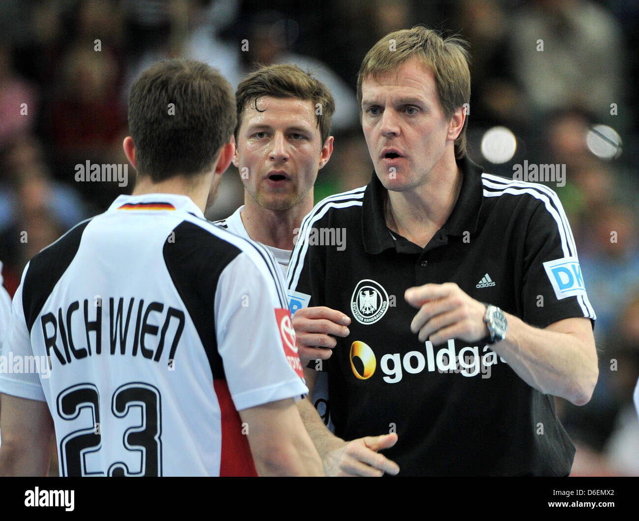 German national handball coach Martin Heuberger talks to his players