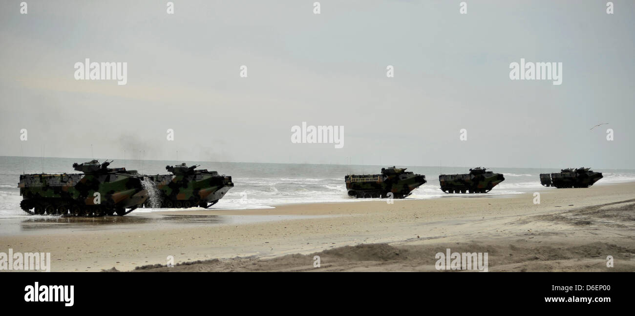 Amphibious assault vehicles (AAV) from the amphibious transport dock ship USS Oak Hill (LSD 51) make their way toward the shore Monday, February 6, 2012 during an amphibious assault exercise as part of Bold Alligator 2012 at Camp Lejeune, North Carolina. Exercise Bold Alligator 2012, the largest naval amphibious exercise in the past 10 years, represents the Navy and Marine Corps' r Stock Photo