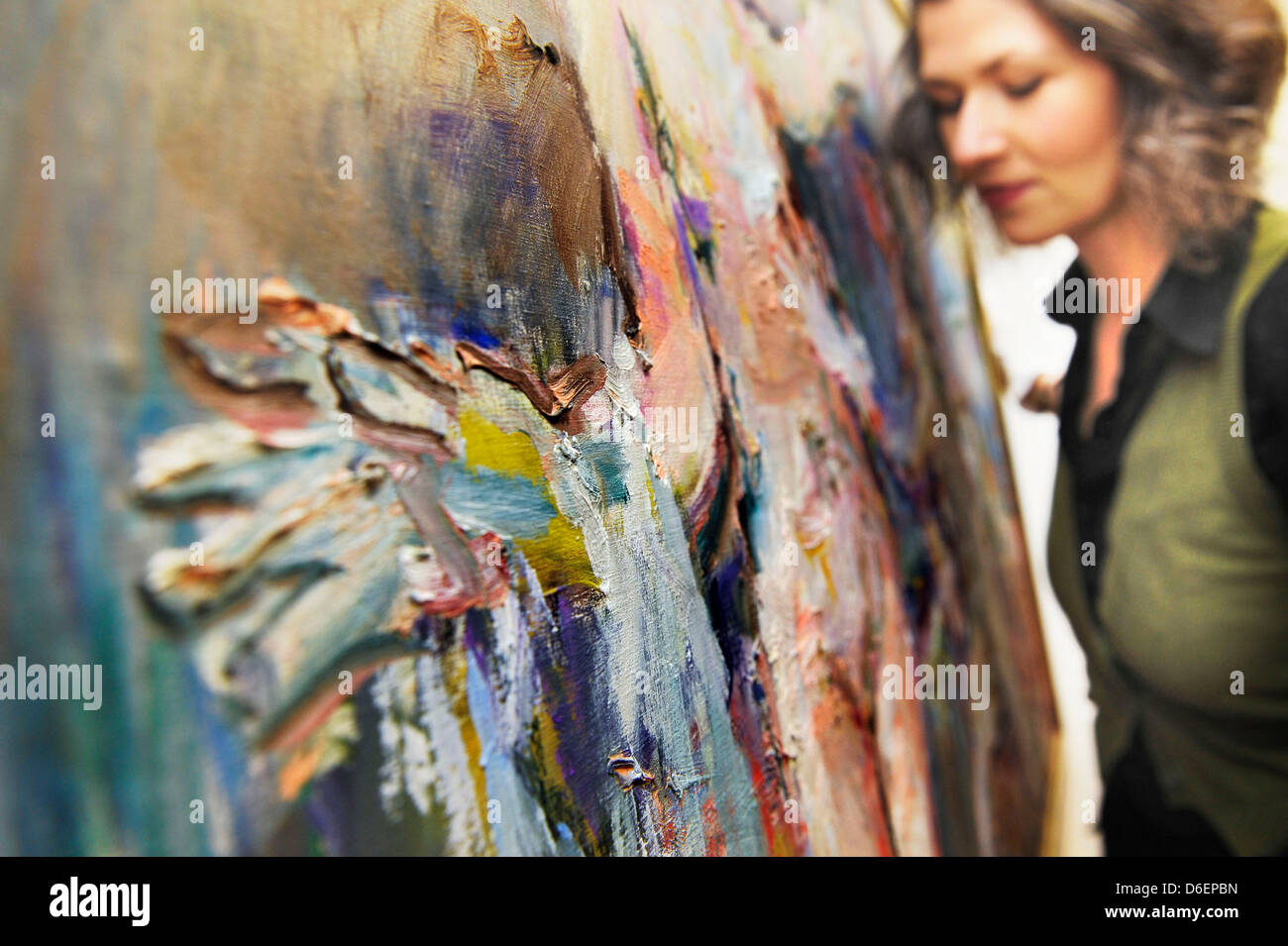 Curator Regina Wetjen hangs the painting 'The Rejected Lover' (1966) by Oskar Kokoschka at the Kunsthaus in Stade, Germany, 08 February 2012. The exhibition consists of lesser known works and sketches by the expressionist painter Oskar Kokoschka. Photo: CHRISTIAN HAGER Stock Photo