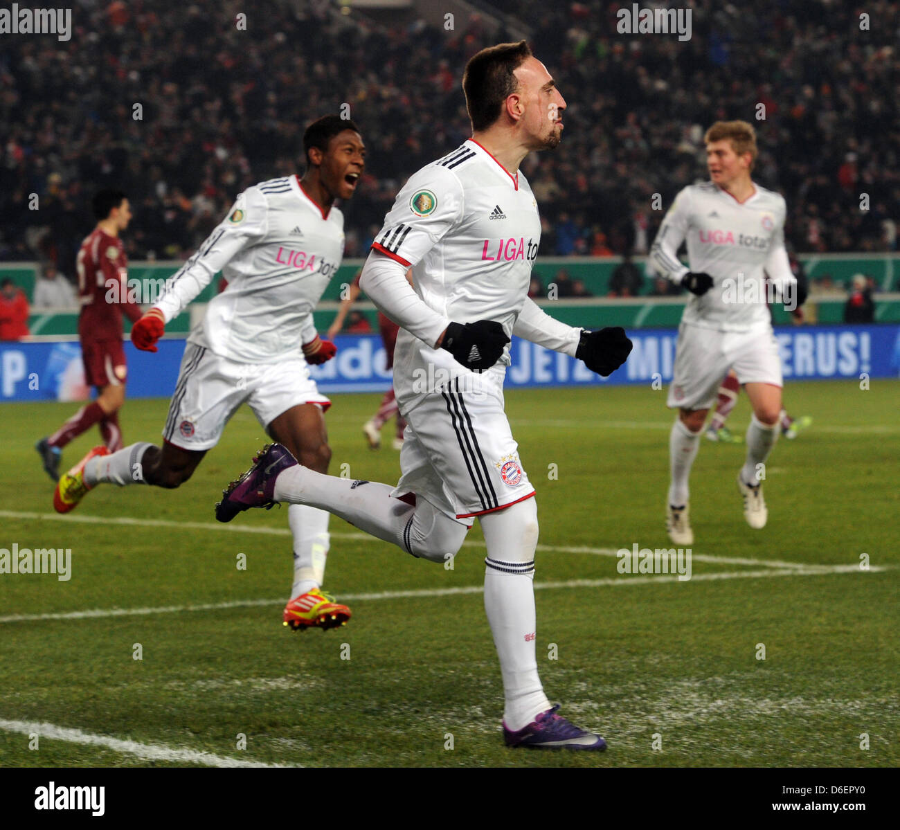 Munich's Franck Ribery (front) cheers after scoring the 0-1 goal with ...
