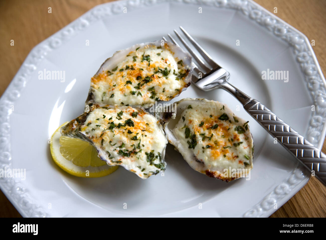 Baked oysters in shell with creme fraiche and Parmesan cheese Stock