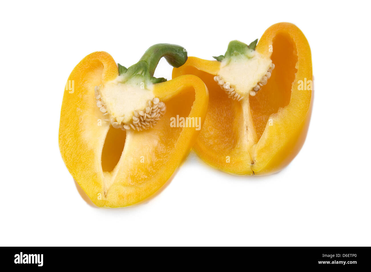 Yellow pepper halves on white background Stock Photo - Alamy
