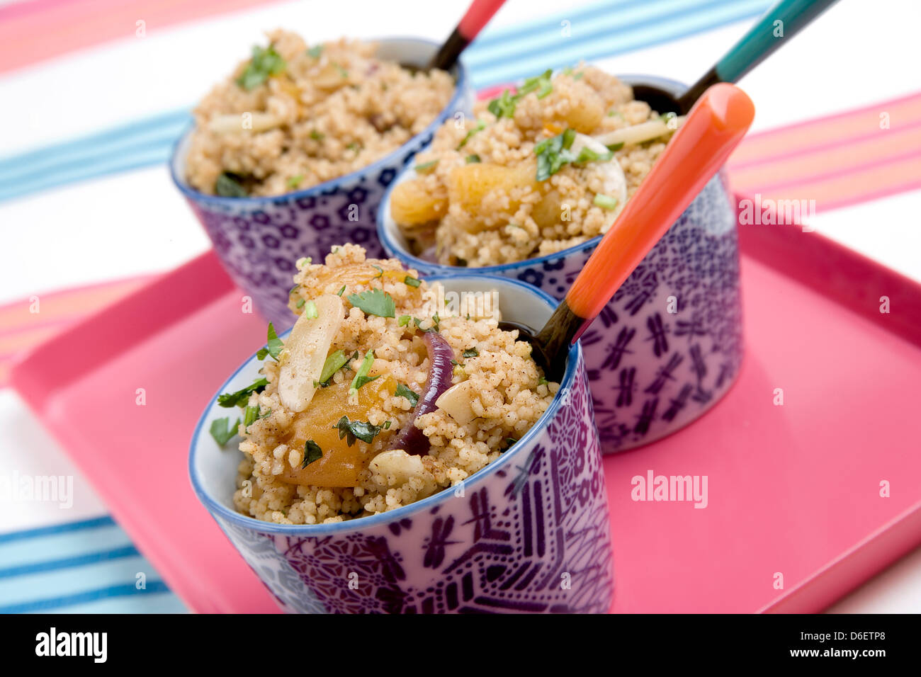 Moroccan Cous Cous with roasted squash, toasted almonds and coriander. Stock Photo