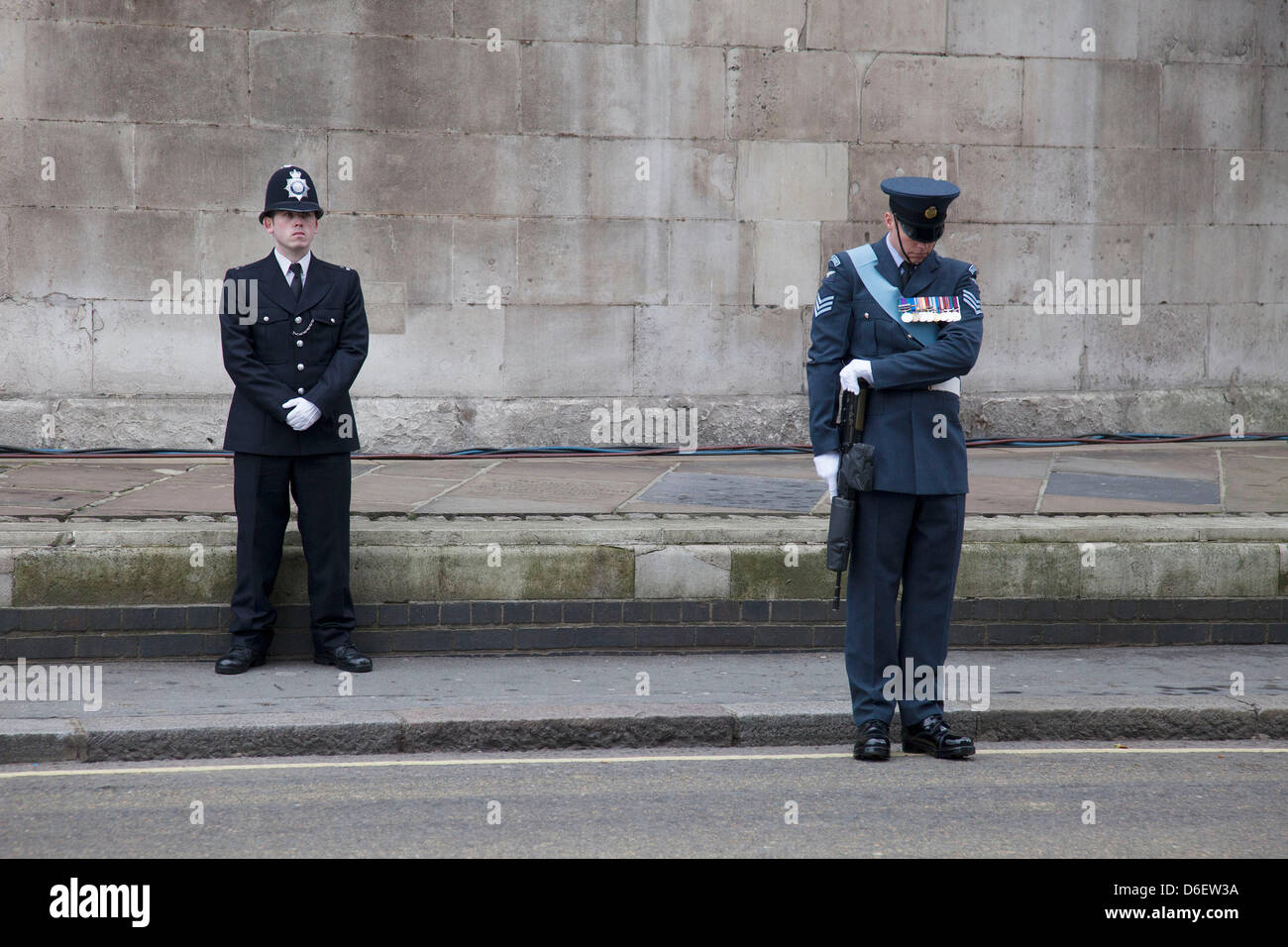 London , UK. 17th April 2013. The funeral of former Prime Minister Baroness Margaret Thatcher. Metropolitan police on duty outside St Clement Danes Church prior to the funeral. Security was high with various layer of the armed forces and emergency services all on hand. Credit: Michael Kemp/Alamy Live News Stock Photo