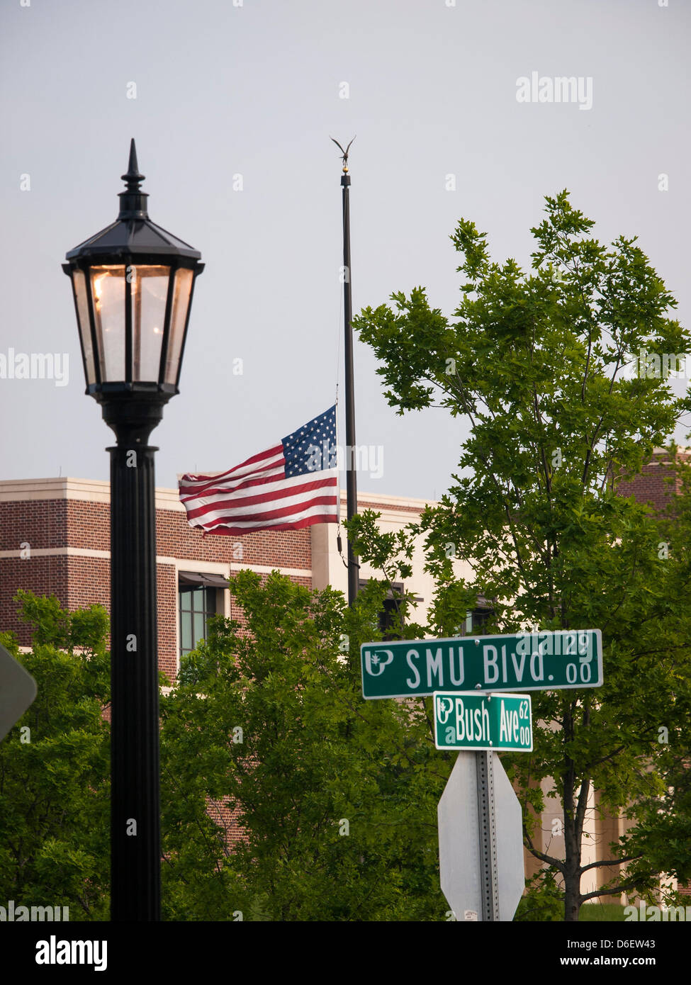 At the intersection of Bush Avenue and SMU Avenue on the Southern Methodist University campus an American flag outside the George W Bush Presidential Library flies at half mass after the Boston marathon bombing. Library will be dedicated at the end of the month Stock Photo