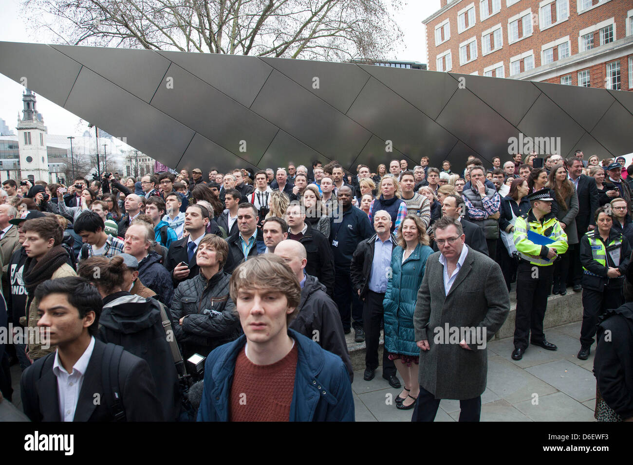 Funeral of former Prime Minister Baroness Margaret Thatcher. Members of the public look on in their hundreds. London, UK. Stock Photo