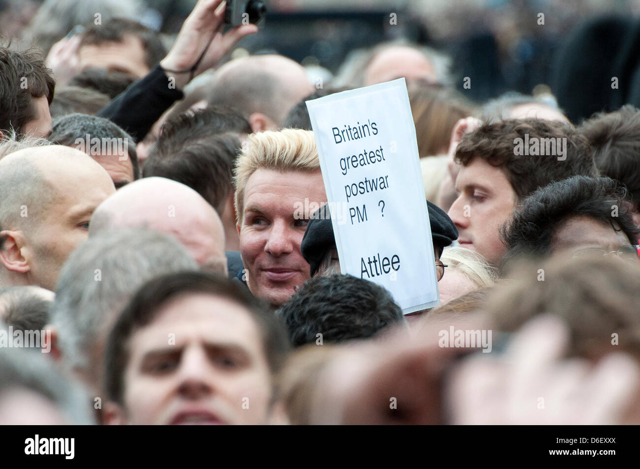 London, UK. 17th April 2013. Anti-Thatcherism printout held aloft during the funeral procession of Baroness Thatcher. Credit: Scott Wishart/Alamy Live News Stock Photo