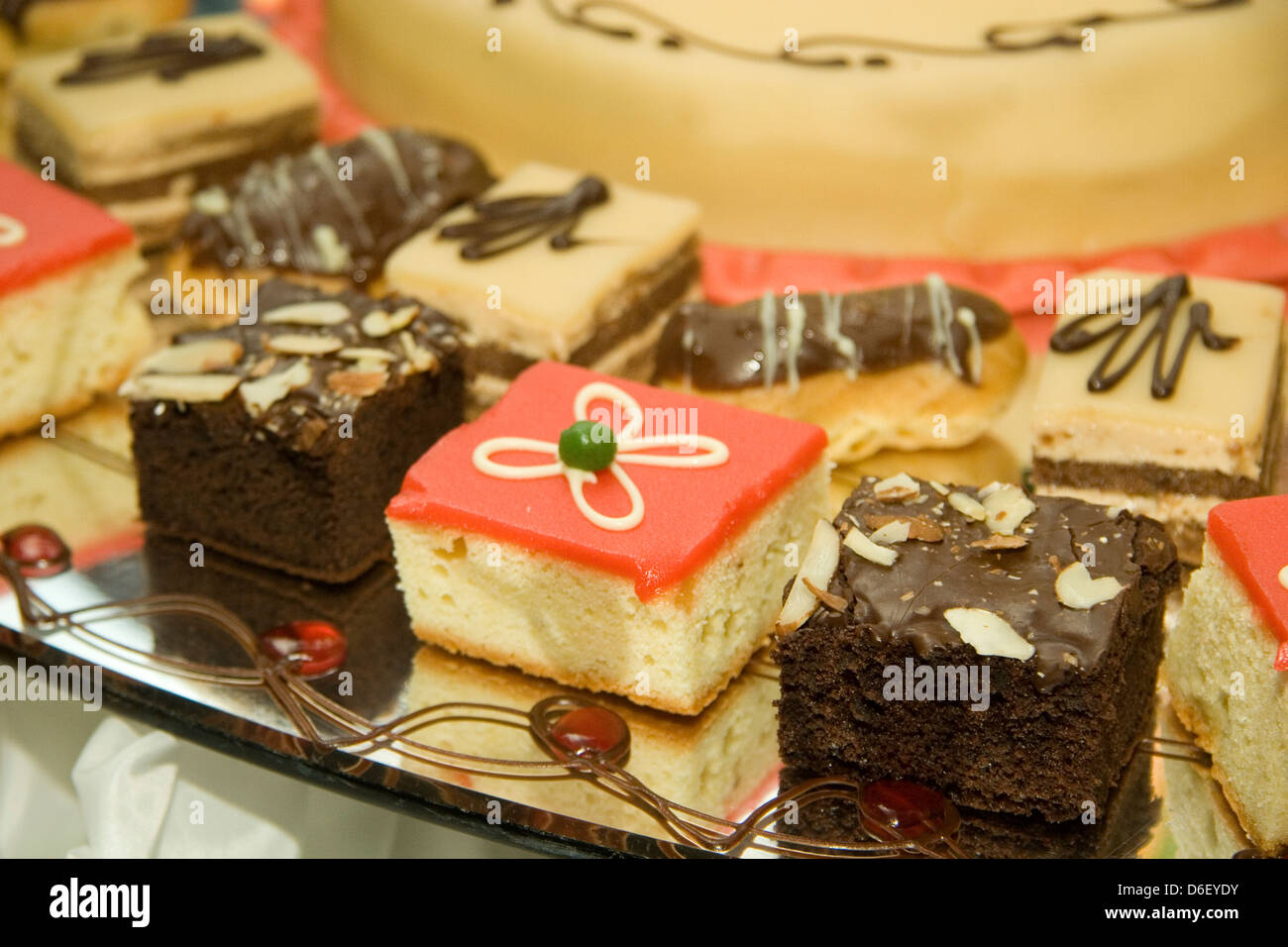 mini cakes and pastries on the dessert buffet of a cruise ship Stock