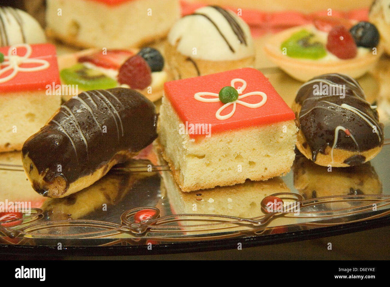 mini cakes and pastries on the dessert buffet of a cruise ship Stock