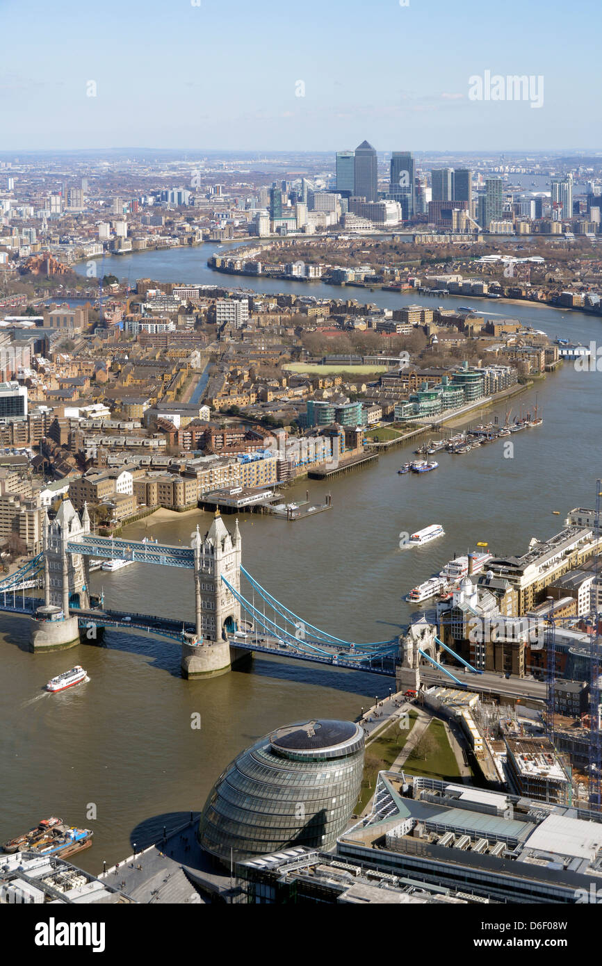 Aerial urban London landscape view from the Shard high tide River Thames from iconic Tower Bridge toward Canary Wharf skyline landmarks England UK Stock Photo