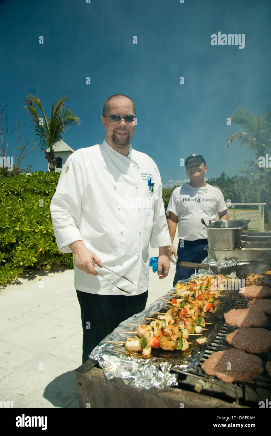 Executive chef of a cruise ship works the bbq grills at Half Moon Cay