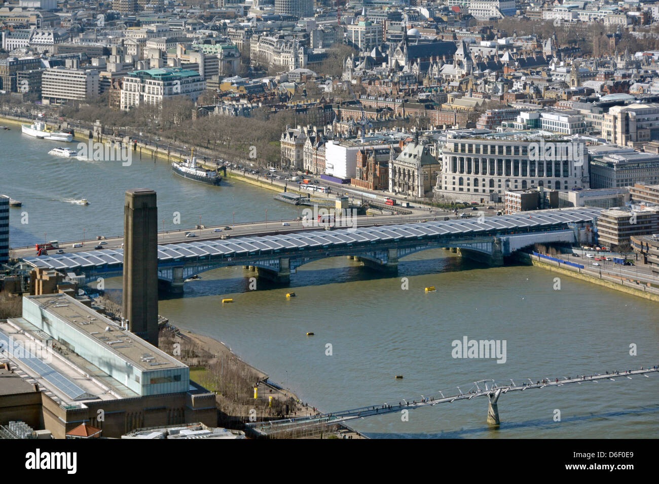 Aerial urban city landscape view down onto Blackfriars Railway Bridge & station roof covered end to end in solar panels River Thames London England UK Stock Photo