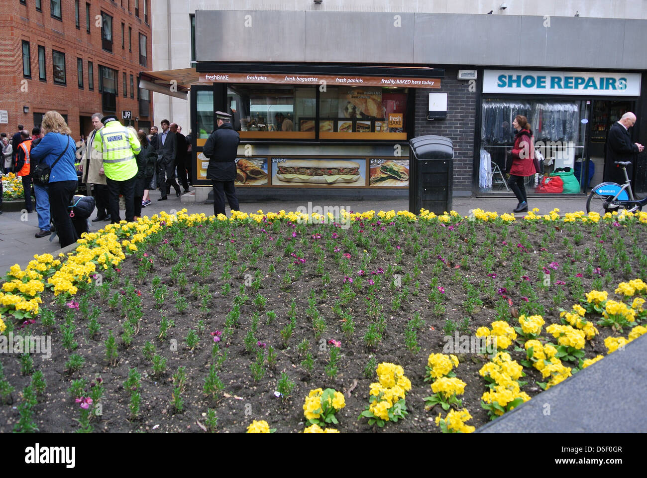 St Paul's, London, flower bed, policeman. Stock Photo