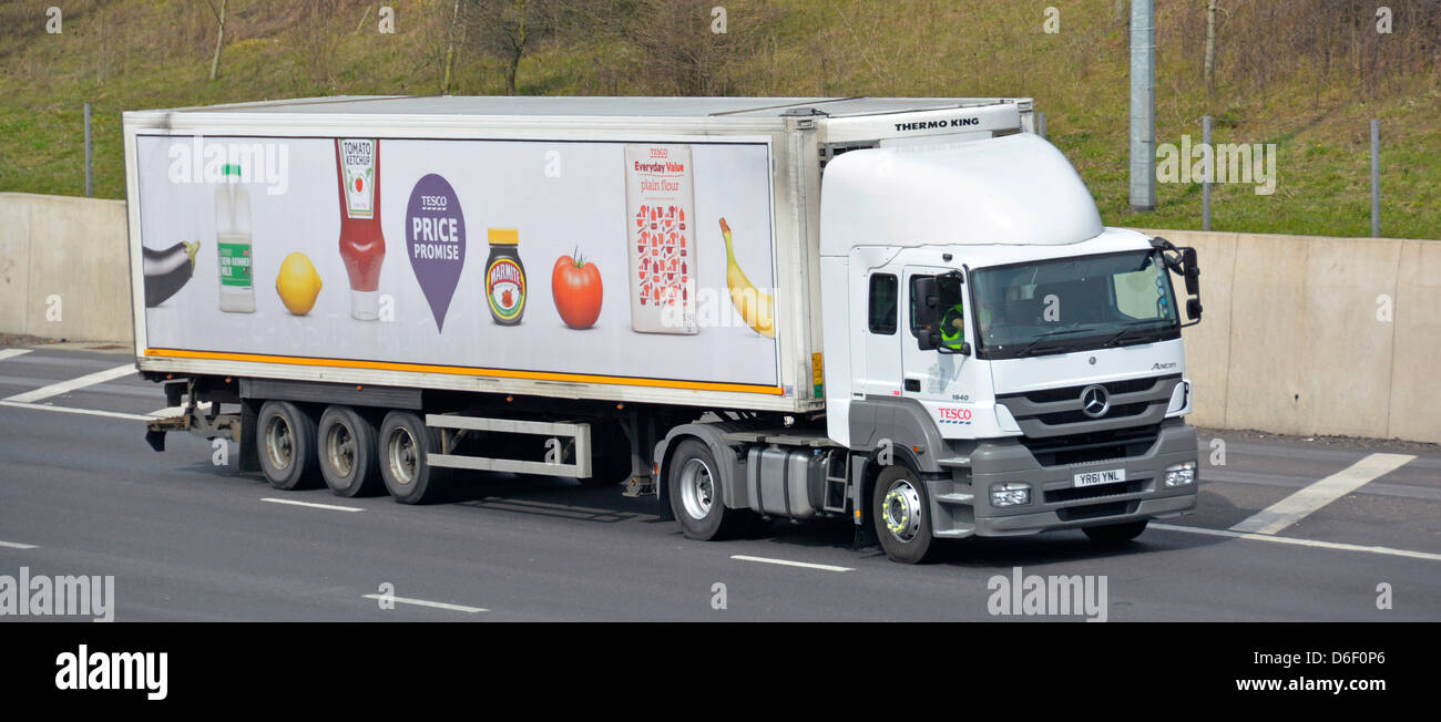 Tesco supermarket delivery lorry and trailer with food related advertising Stock Photo