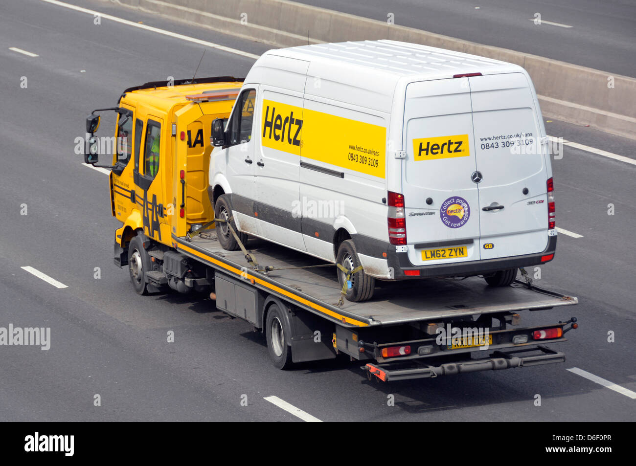 Hertz rental van being transported on AA breakdown recovery truck Stock  Photo - Alamy
