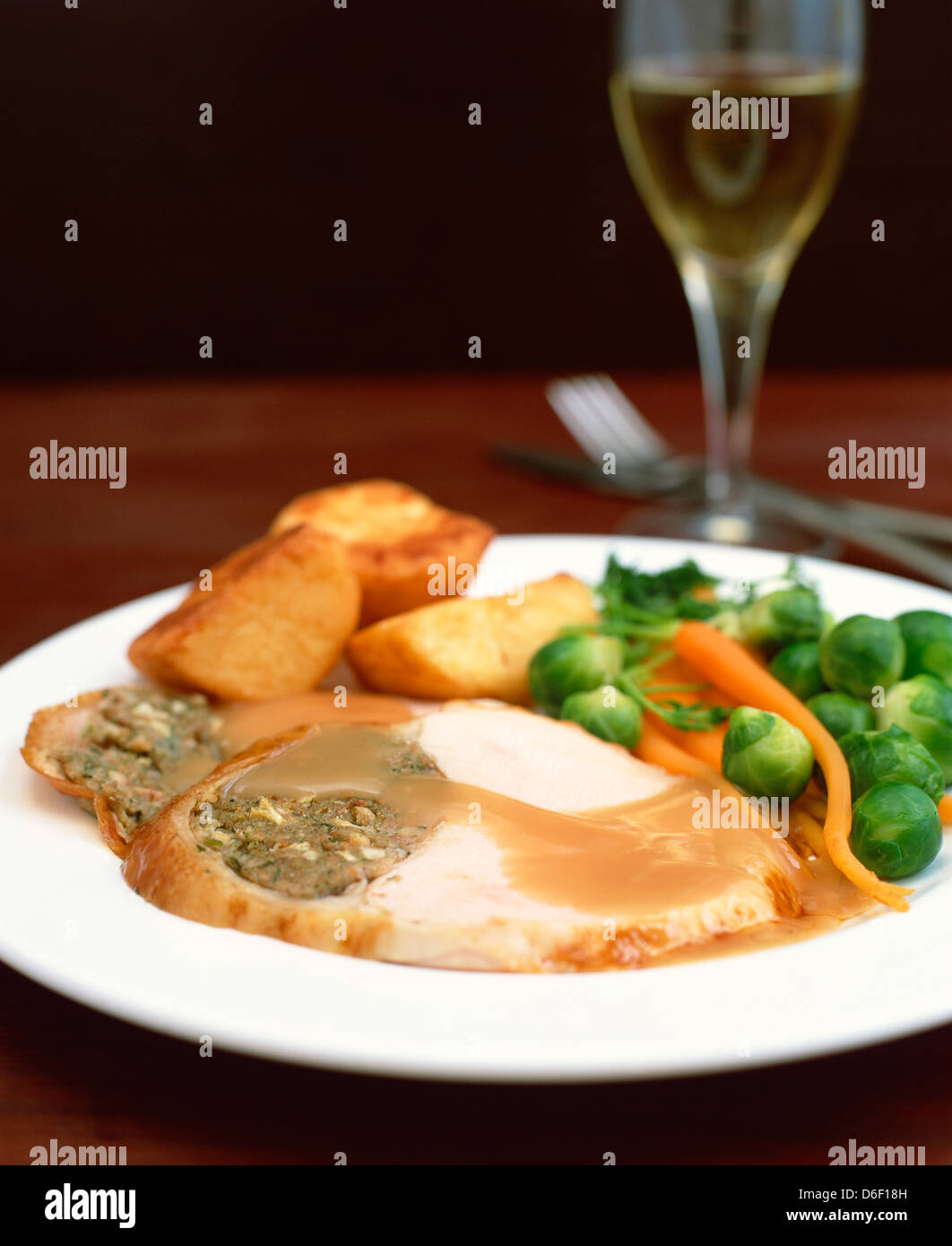 Sliced turkey with stuffing, gravy and vegetables Stock Photo Alamy