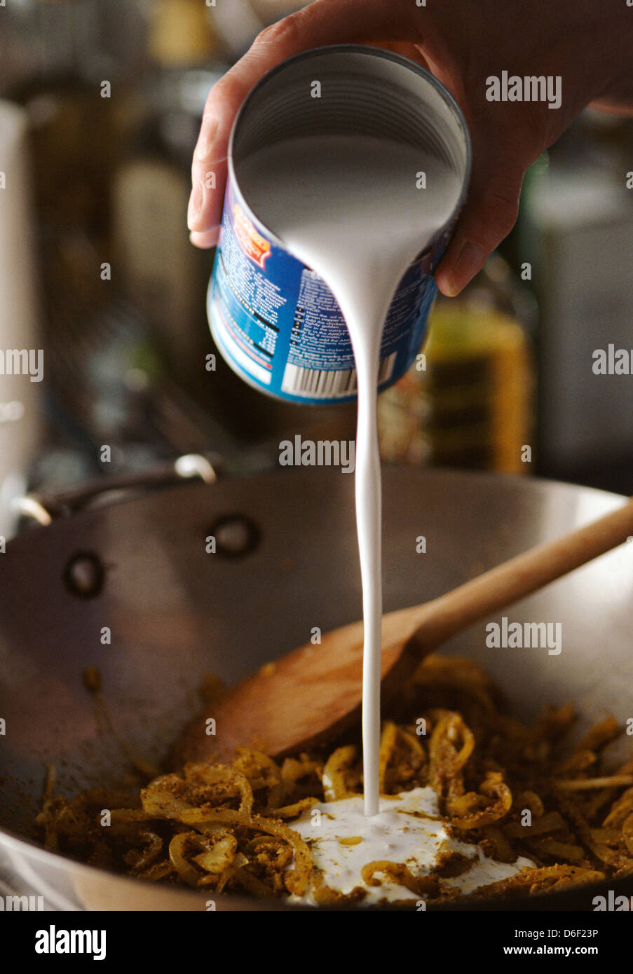 Adding Coconut Milk to Pan Stock Photo Alamy
