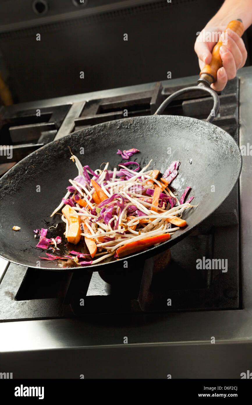 Chef Cooking Vegetables In Wok Stock Photo Alamy