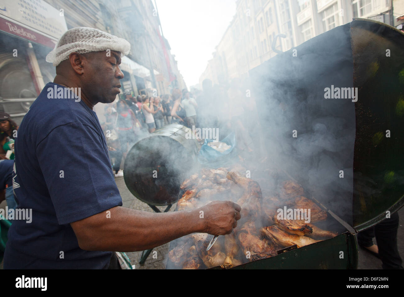 Berlin, Germany, a resident barbecue Haehnchen on the MyFest in Kreuzberg Stock Photo