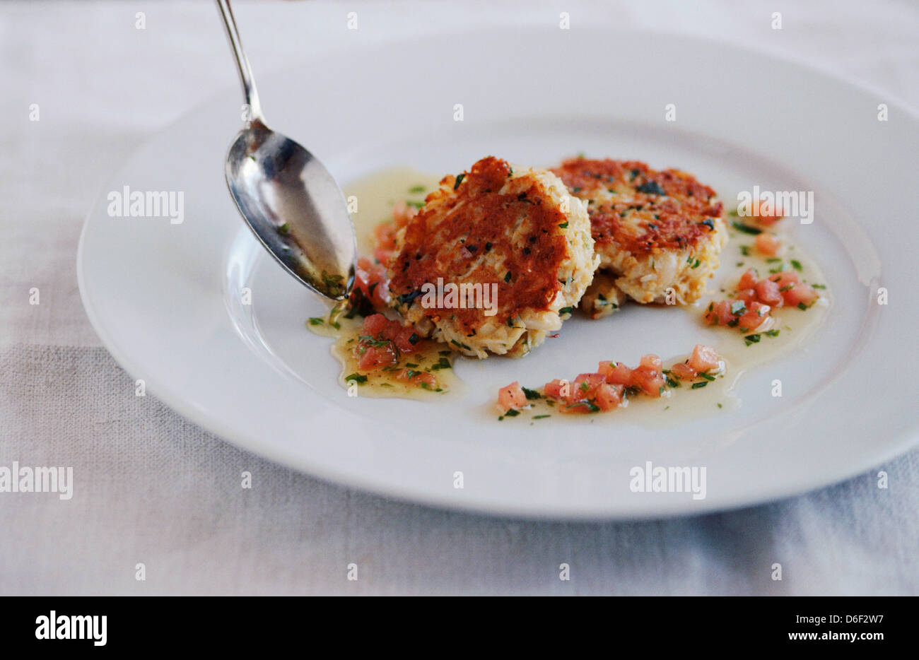 Crab Cakes with a Tarragon Butter Dressing Stock Photo Alamy