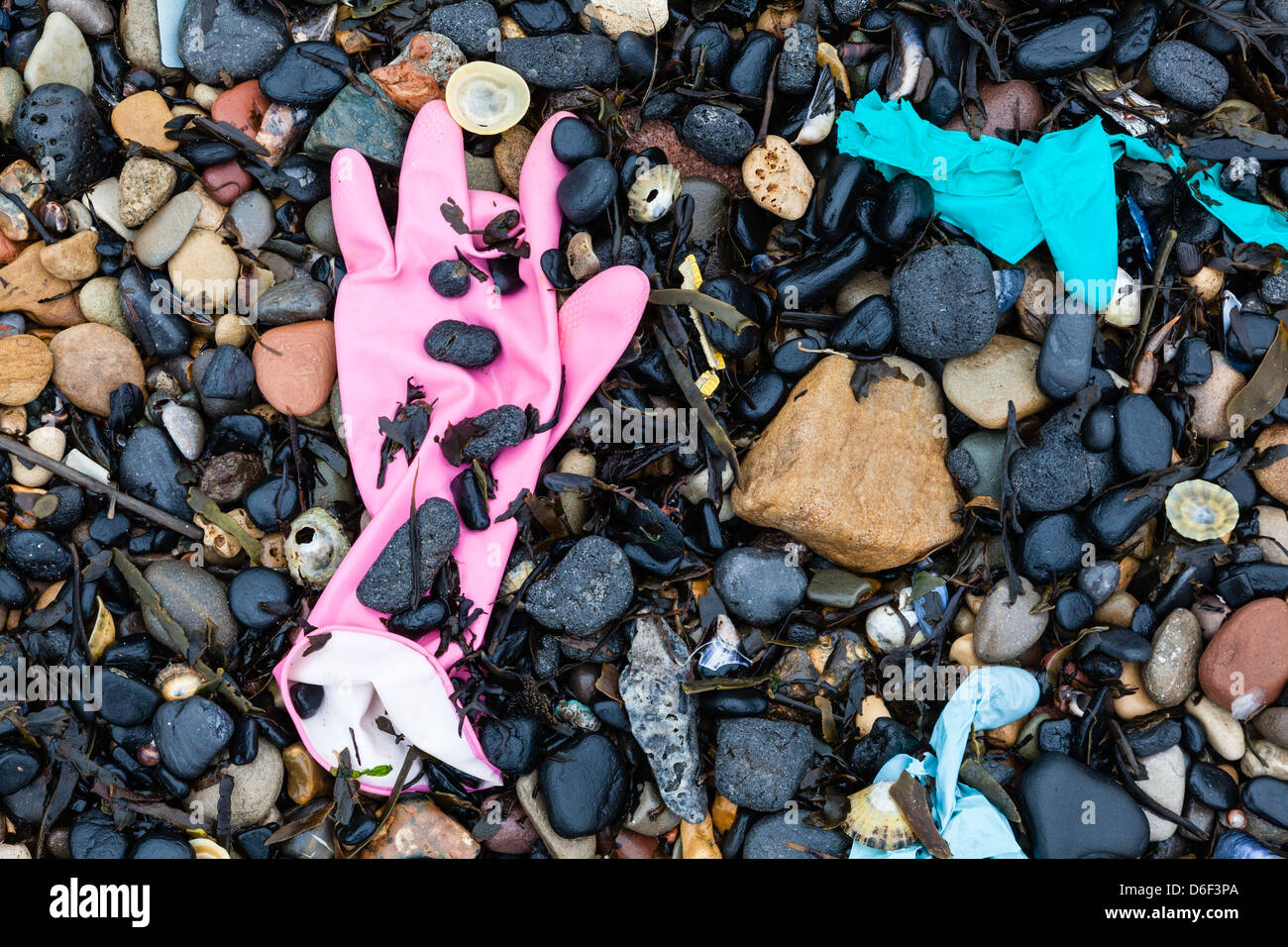 Gloves among the pebbles on the River Tyne North Sheilds, Tyne and Wear, UK Stock Photo