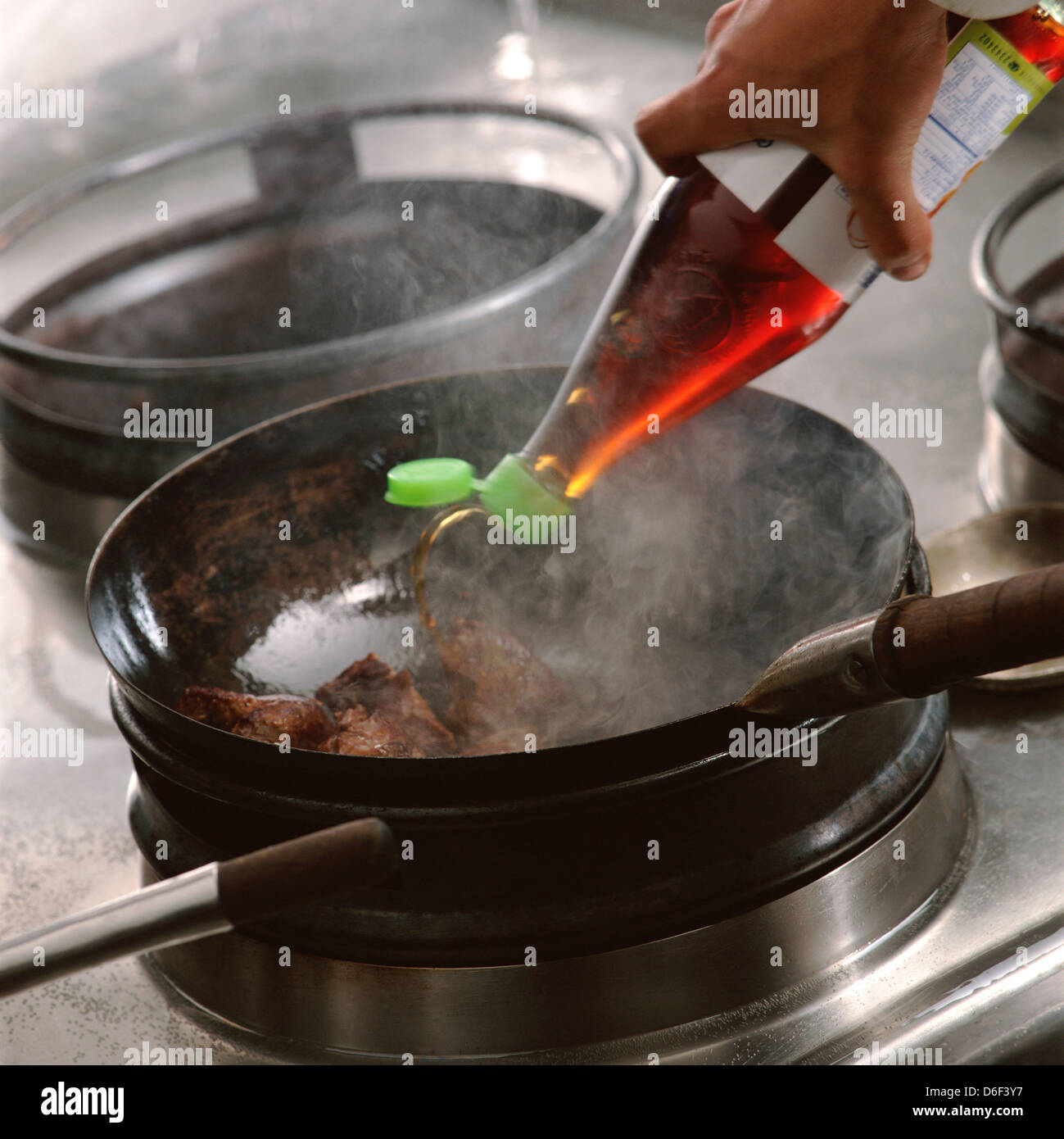 Pouring Thai Fish Sauce into Wok Stock Photo - Alamy