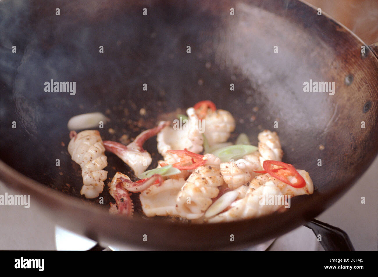 Stirfrying Salt and Pepper Squid Stock Photo Alamy