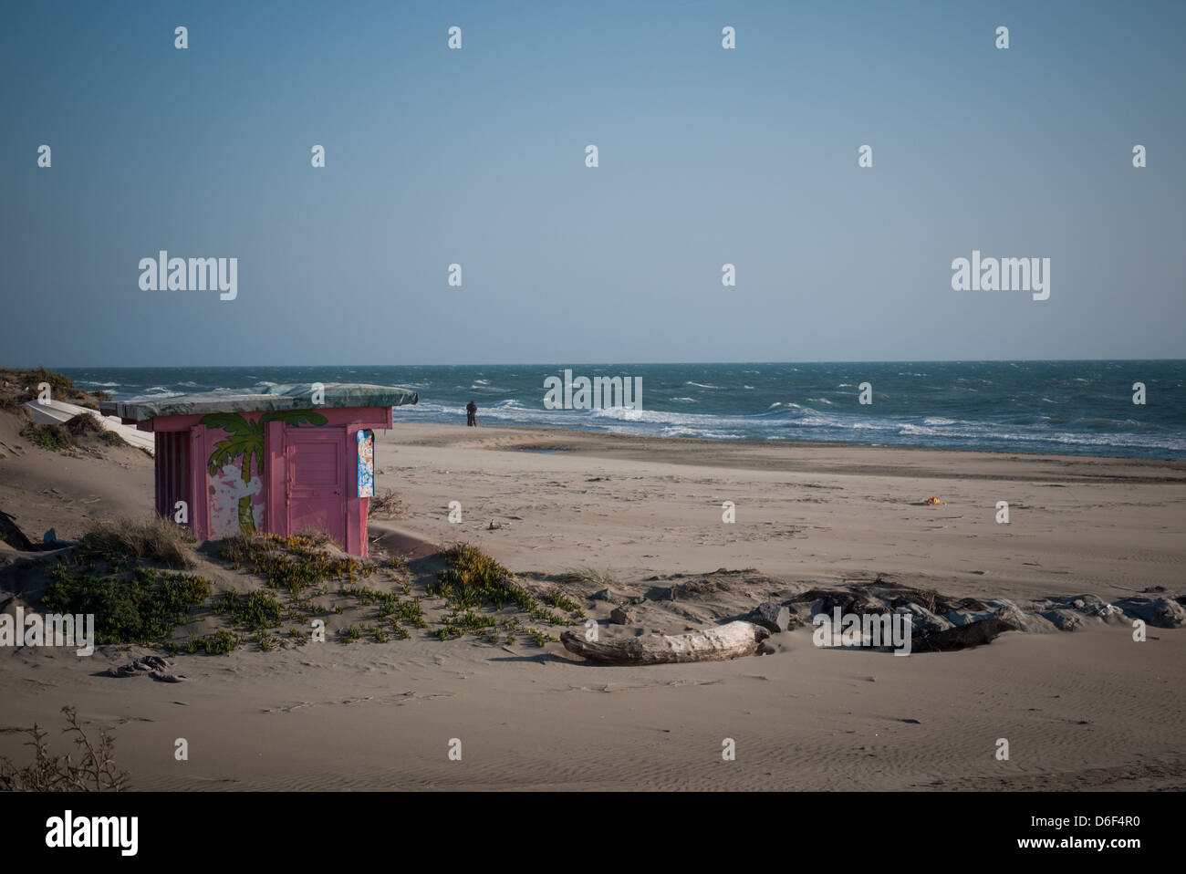 little pink house on the beach in winter. Stock Photo