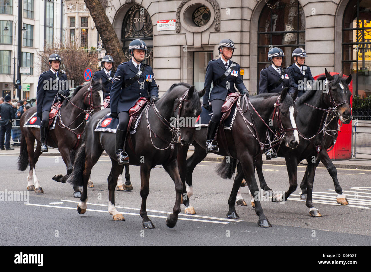 London Aldwych Strand Baroness Margaret Maggie Thatcher funeral cortege parade mounted Metropolitan Police street scene horse horses Stock Photo