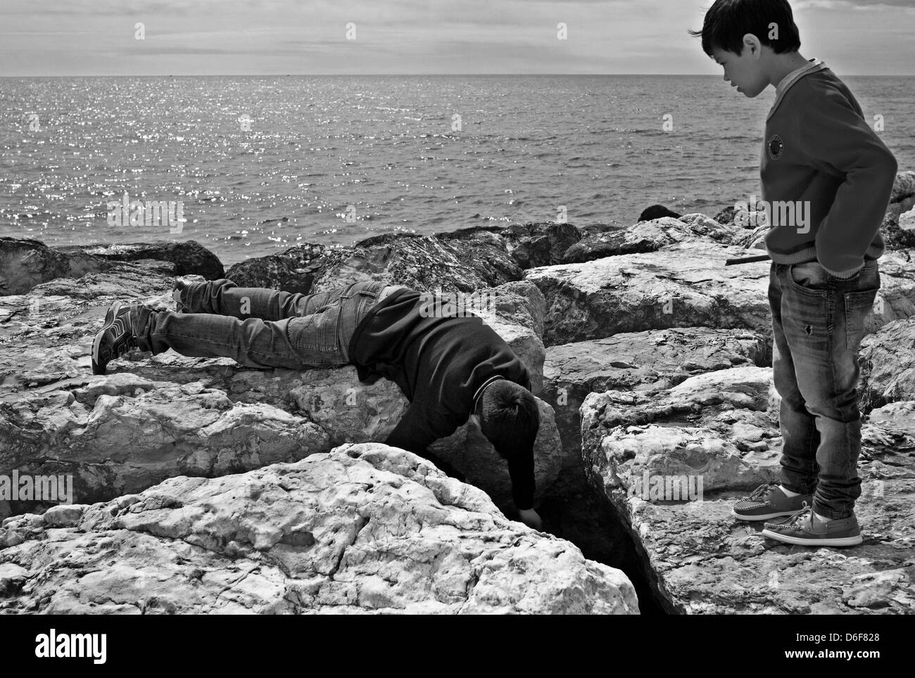 -Fellowship- Kids playing in Outdoors. Mediterranean Sea (Spain). Stock Photo