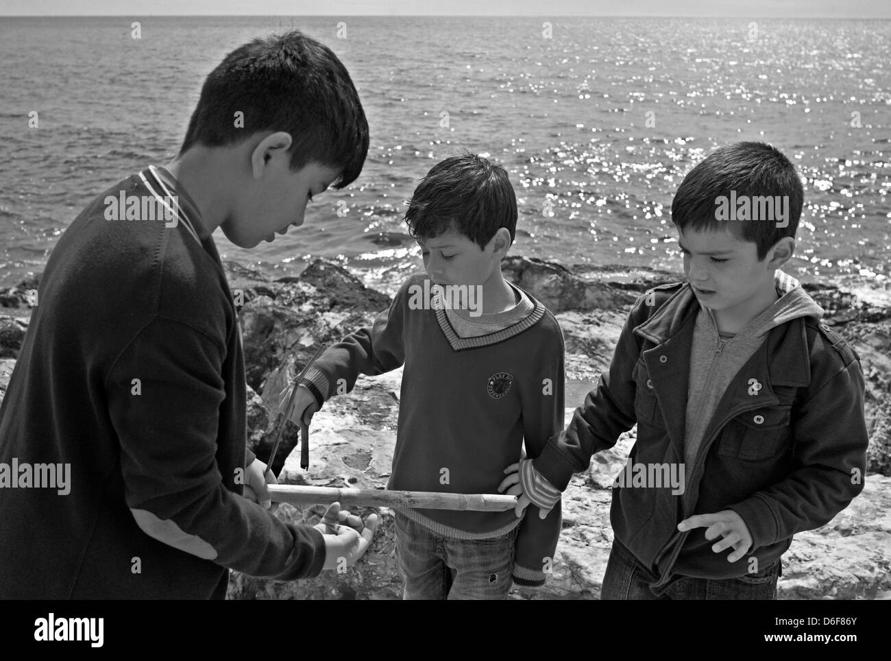 -Fellowship- Kids playing in Outdoors. Mediterranean Sea (Spain). Stock Photo